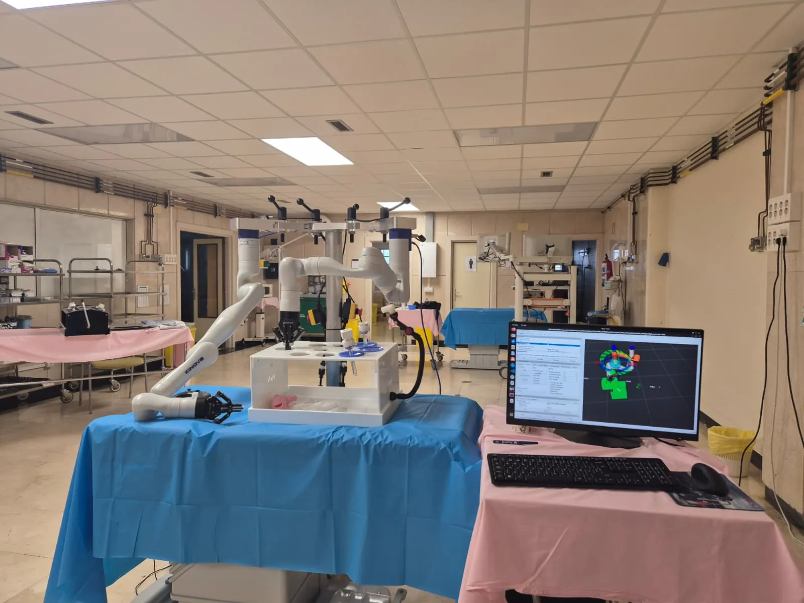 The dual-arm surgical robot in a hospital simulation room