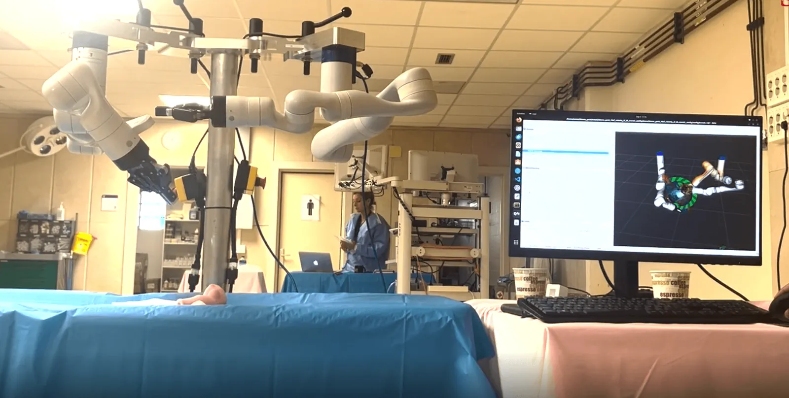 The robot’s two arms and the control screen during a test